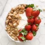 Macadamia and Coconut Granola bowl with yoghurt and strawberries